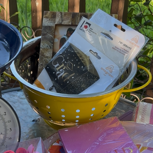 Packaged grad balloons in yellow colander